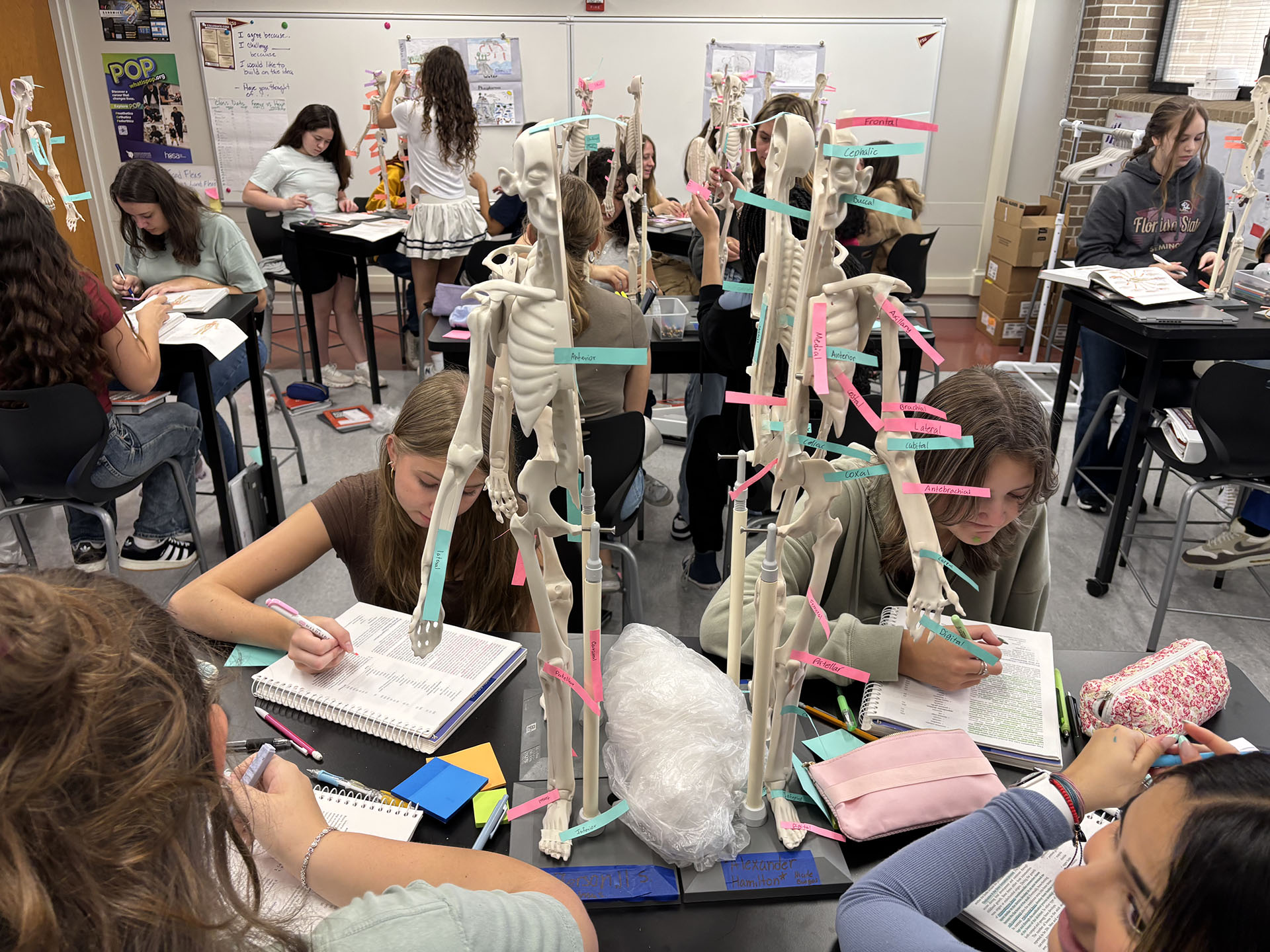 Busy science classroom with kids working on group projects