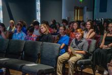 Image of attendees and students at the collegiate school commissioning ceremony