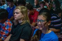 Image of attendees and students at the collegiate school commissioning ceremony