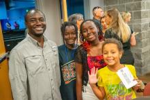 Image of attendees and students at the collegiate school commissioning ceremony