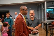 Image of attendees and students at the collegiate school commissioning ceremony