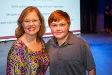 Image of attendees and students at the collegiate school commissioning ceremony