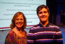 Image of attendees and students at the collegiate school commissioning ceremony